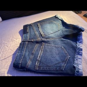 Kendall + Kylie dark blue jean shorts.